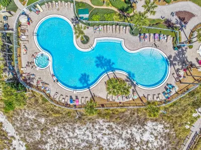 an overhead view of a swimming pool at a resort at Grand Panama #2-1307 in Panama City Beach