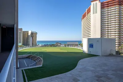 a golf course on the balcony of a building at Laketown Wharf #2136 by Nautical Properties in Panama City Beach
