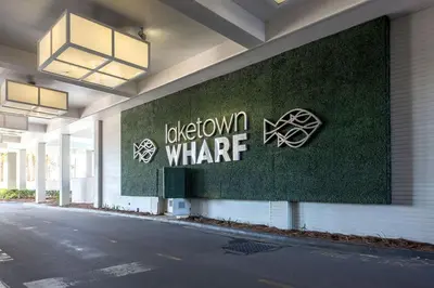 a building with a sign on the side of it at Laketown Wharf #1509 by Nautical Properties in Panama City Beach