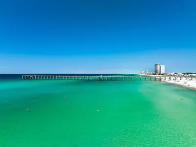 a view of a beach with a pier and buildings at Seaspray Hideaway Sleeps 8 Pools Beach Access in Panama City Beach