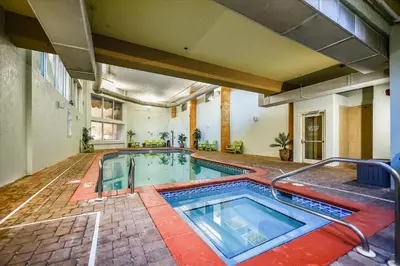 an indoor swimming pool in a building at Shores of Panama 1717 - 1 Bedroom Bunk room Sleeps 6, Gulf-Front with Oversized Balcony! condo in Panama City Beach