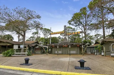 a building with a sign on top of it at Shores of Panama 1418 - 2 BedroomBunkroom Sleeps8! Updated with a View! Free Fun! condo in Panama City Beach