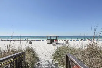 a beach with a gazebo on the sand at Shores of Panama 1807 -Fantastic 2BdBunks, Sleeps 8! Reserved Parking! Free Fun condo in Panama City Beach