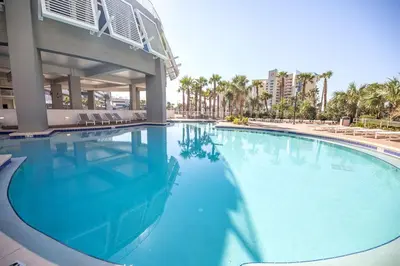 a large swimming pool in front of a building at Laketown Wharf #1707 by Nautical Properties in Panama City Beach