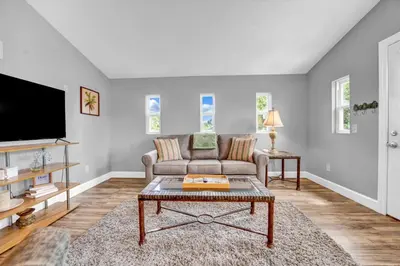 a living room with a couch and a tv at Adorable 1 BDR with Full Kitchen Deck Washer Dryer in Panama City