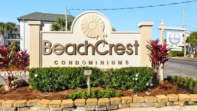 a sign for the beach crest condominium at BeachCrest 501 in Santa Rosa Beach