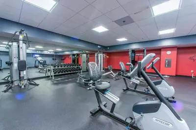 a gym with cardio equipment in a room at Emerald Beach 431 in Panama City Beach