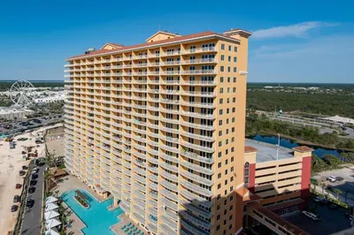 an aerial view of a tall building with a pool at Calypso 3-2210 - Love Nest in Panama City Beach