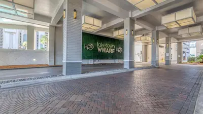 an empty lobby of a building with a sign on it at Penthouse Perfection at Laketown Wharf #2127 by Nautical Properties in Panama City Beach