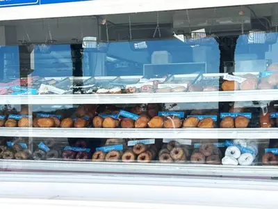 a display of donuts in a store window at The Coastal Cabana in Panama City Beach