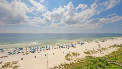 an aerial view of a beach with umbrellas and the ocean at Beachfront Condo #712 at Majestic Beach Resort in Panama City Beach