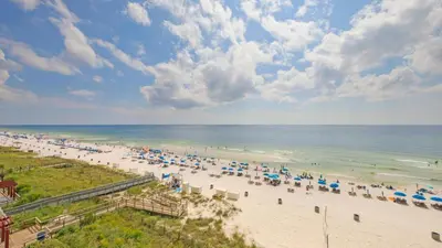 an overhead view of a beach with umbrellas and the ocean at Beachfront Condo #712 at Majestic Beach Resort in Panama City Beach