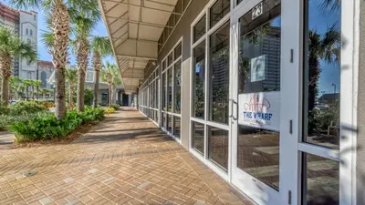 a hallway of a building with palm trees at Laketown Wharf #1807 by Nautical Properties in Panama City Beach