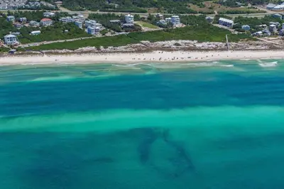 an aerial view of a beach and the ocean at Cassine Gardens 212 in Santa Rosa Beach