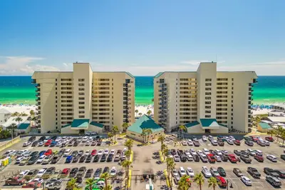 an aerial view of a parking lot at a resort at Sunbird Resort! Incredible Beachfront Corner Unit! Free Beach Chairs! by Dolce Vita Getaways PCB in Panama City Beach