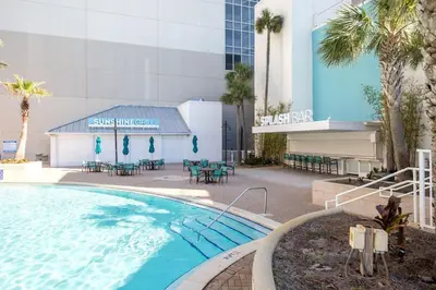 a large swimming pool in front of a building at Laketown Wharf #1106 by Nautical Properties in Panama City Beach