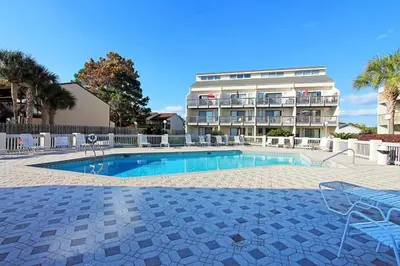 a swimming pool in front of a apartment building at Endless Summer B4 in Panama City Beach