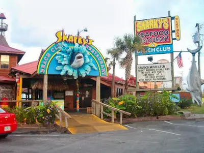 a restaurant with a sign for a seafood restaurant at Emerald Beach 930 in Panama City Beach