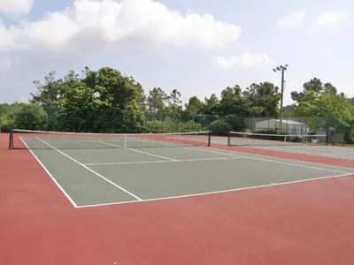 a tennis court with a net on top of it at Beachside Villas 911 in Seagrove Beach