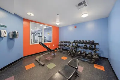 a gym with cardio equipment and chairs in a room at Shores Of Panama #0912 in Panama City Beach