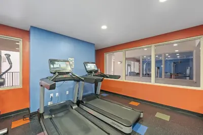 a gym with two treadmills in a room at Shores Of Panama #0912 in Panama City Beach
