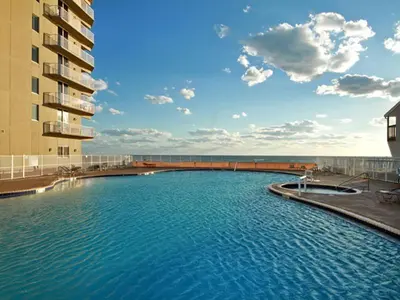 a large swimming pool in front of a building at Tidewater Beach Resort #1306 - Beach Bliss in Panama City Beach