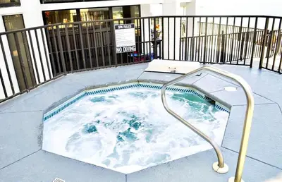 a jacuzzi tub with a shower in it at Aquavista 504W in Panama City Beach