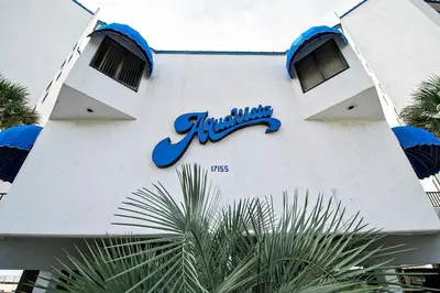 a building with a sign on the side of it at Aquavista 504W in Panama City Beach
