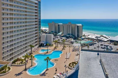 an aerial view of a resort with a pool and beach at Beach & Ocean Views! Steps to Beach & Dining, Sleeps 9! Dolce Vita Getaways PCB in Panama City Beach