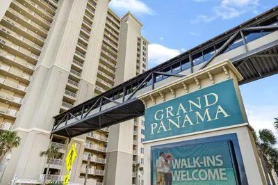 a sign in front of the grand panama hotel at Grand Panama #1-1207 in Panama City Beach