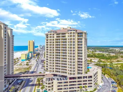 an aerial view of a building with the ocean in the background at Grand Panama #1-1207 in Panama City Beach