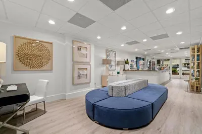 a store with a blue ottoman in a room at Grand Panama #1-2201 in Panama City Beach