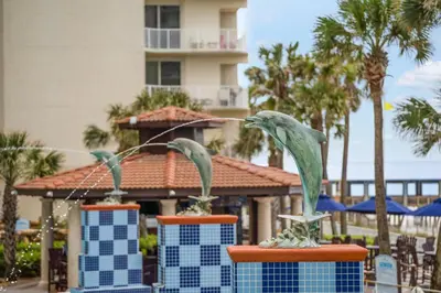 two statues of birds on a table at a resort at Shores Of Panama #1412 in Panama City Beach