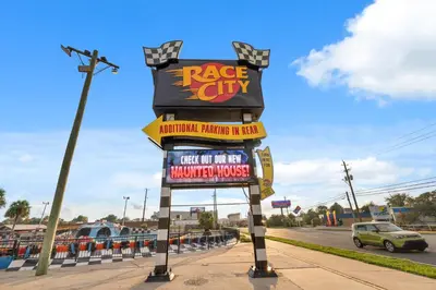 a large sign for a race city restaurant on a street at Spectacular Gulf Views w/ PRIVATE POOL! Remarkable 3BR 35BA Bedding for 12! in Panama City Beach