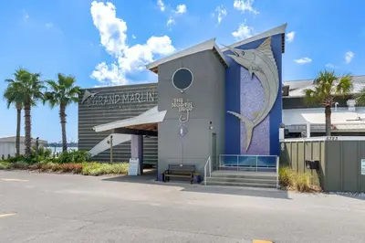 a building with a mural on the side of it at Spectacular Gulf Views w/ PRIVATE POOL! Remarkable 3BR 35BA Bedding for 12! in Panama City Beach