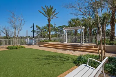 a park with a bench and a gazebo at Laketown Wharf #1824 in Panama City Beach