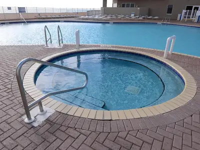 a small swimming pool with a hand rail in it at Tidewater 0401 in Panama City Beach