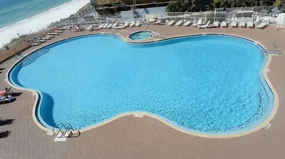 an overhead view of a swimming pool next to the beach at Tidewater 0401 in Panama City Beach