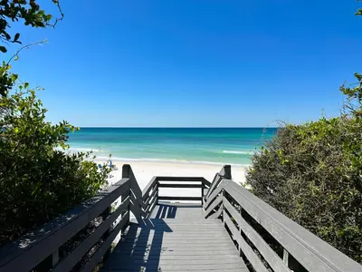 a wooden pathway to the beach with the ocean at One Seagrove Place #507 in Santa Rosa Beach