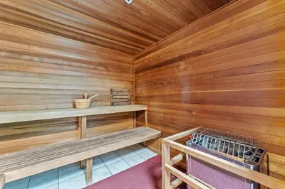 a sauna with wooden walls and benches in a cabin at Tropic Winds 2007 in Panama City Beach
