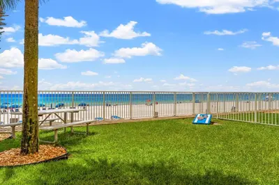 a view of the beach from the balcony of a condo at Tropic Winds 2007 in Panama City Beach