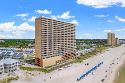 an aerial view of a hotel and the beach at Tropic Winds 603 in Panama City Beach