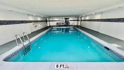 a large swimming pool with blue water in a building at Ocean Reef 2204 in Panama City Beach