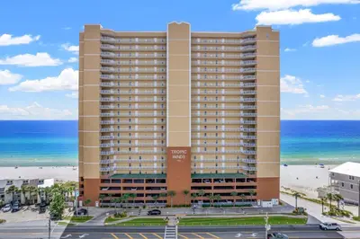 a large building with the ocean in the background at Tropic Winds 904 in Panama City Beach
