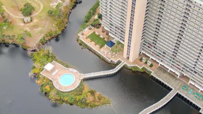 an aerial view of a large building next to a body of water at Laketown Wharf #1517 by Nautical Properties in Panama City Beach