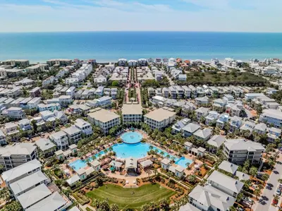an aerial view of a resort with a pool and the ocean at Pool's Paradise in Rosemary Beach