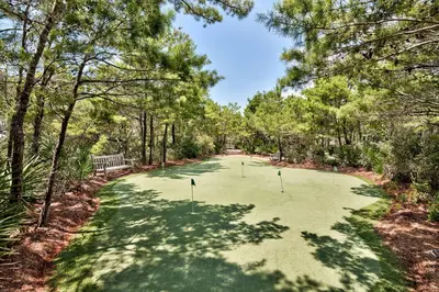 a golf course with three putts in the middle at Barefoot at the Beach in Watersound Beach