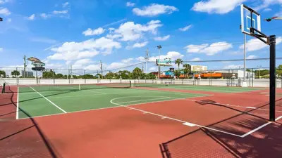 a tennis court with a net on top of it at The Summit 1222 in Panama City Beach