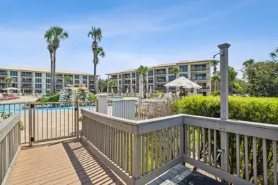 a balcony with a pool and a resort at HP 45W What the Heck by 30A Escapes in Rosemary Beach