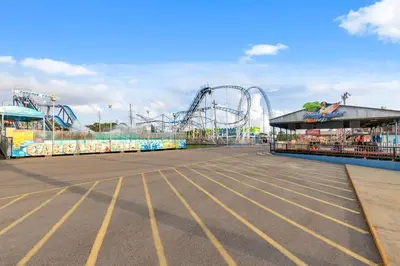 an empty amusement park with a roller coaster at Watercrest 1704 - Serenity Shores in Panama City Beach